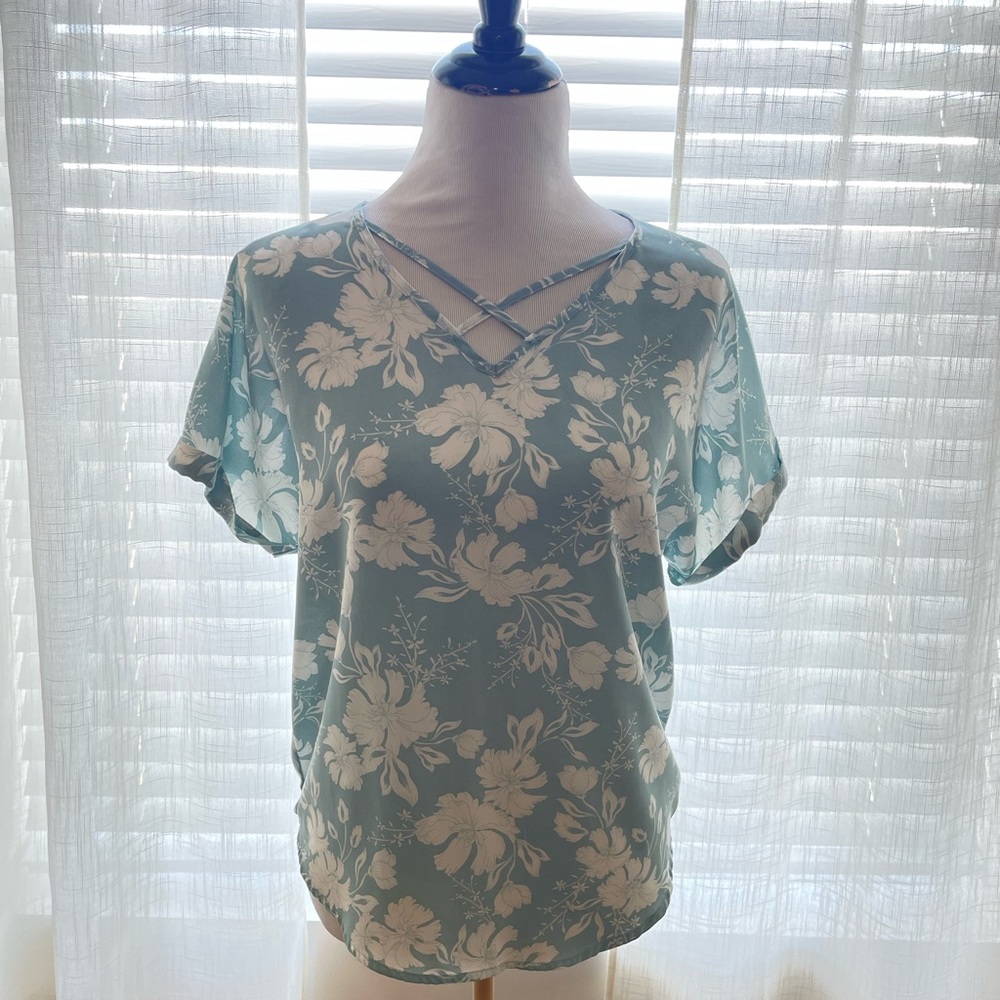 Blue floral top with a criss cross chest